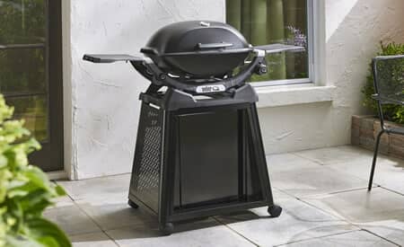 Weber Q1200N BBQ in backyard