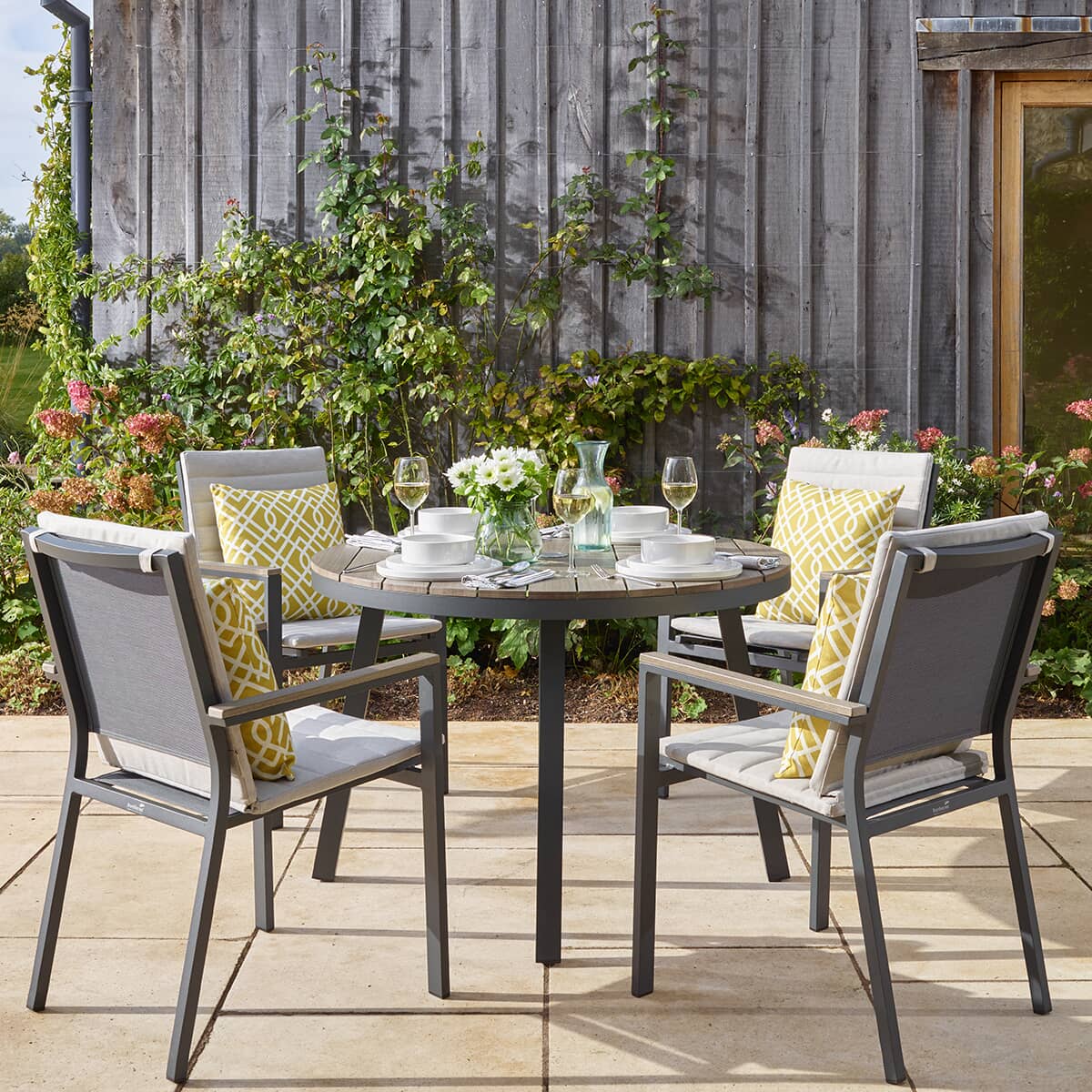 Bramblecrest Zurich 110cm Round Tree-Free Table with 4 Chairs