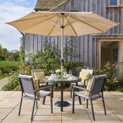 Bramblecrest Zurich 110cm Round Tree-Free Table with 4 Stacking Chairs with Parasol Eco Fawn