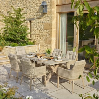Bramblecrest Monterey Ceramic Rectangle Dining Set with 6 Rattan Vogue Deluxe Armchairs in Sandstone 