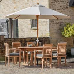 Bramblecrest Richmond 180 x 110cm Oval Dining Table with 6 Stacking Armchairs Seat Cushions Parasol And Base