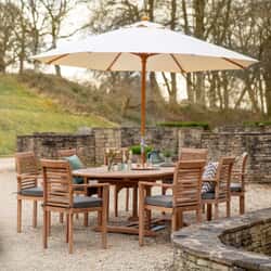 Bramblecrest Richmond 240cm Double Extending Oval Table with 8 Stacking Armchairs Seat Cushions Parasol And Base