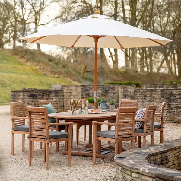 Bramblecrest Richmond 240cm Double Extending Oval Table with 8 Stacking Armchairs Seat Cushions Parasol And Base