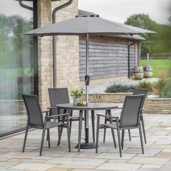Bramblecrest Sofia 110cm Round Table with 4 Stacking Armchairs Parasol And Base Anthracite