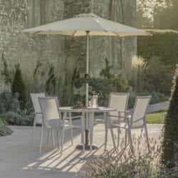 Bramblecrest Sofia 110cm Round Table with 4 Stacking Armchairs Parasol And Base Grey