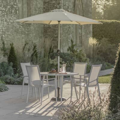 Bramblecrest Sofia 110cm Round Table with 4 Stacking Armchairs Parasol And Base Grey