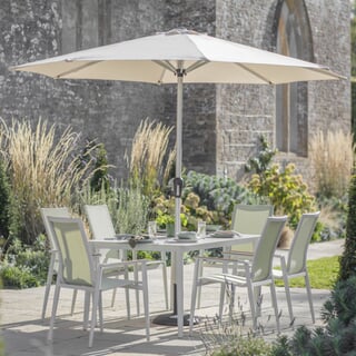 Bramblecrest Sofia 165 x 95cm Rectangle Dining Table with 6 Stacking Armchairs Parasol And Base In Green
