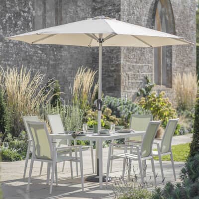 Bramblecrest Sofia 165 x 95cm Rectangle Dining Table with 6 Stacking Armchairs Parasol And Base In Green
