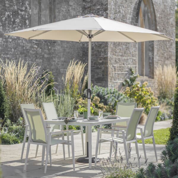 Bramblecrest Sofia 165 x 95cm Rectangle Dining Table with 6 Stacking Armchairs Parasol And Base In Green