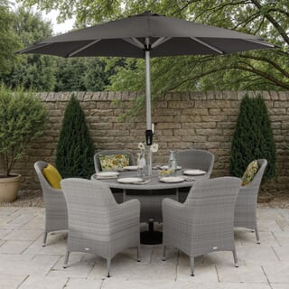 Bramblecrest Tetbury 135cm Tree-Free Round Dining Table with 6 Armchairs Parasol  Base Graphite/Smoke