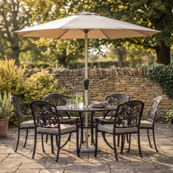 Bramblecrest Venice 136cm Round Dining Table with 6 Stacking Armchairs Parasol And Base In Bronze