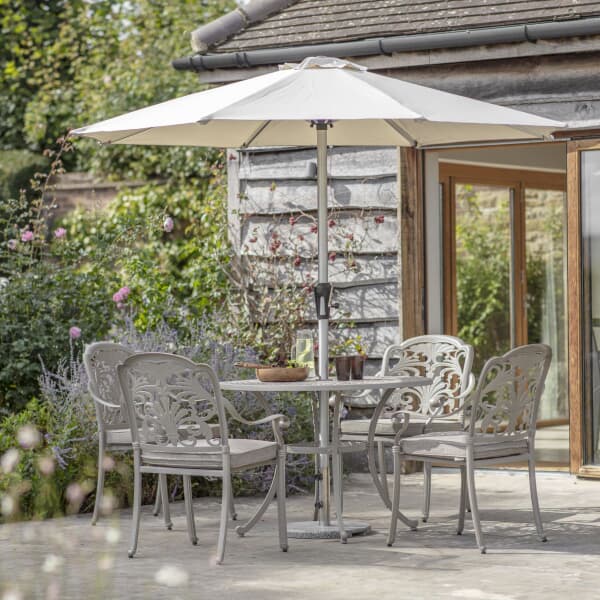 Bramblecrest Venice 100cm Round Table with 4 Stacking Armchairs Parasol And Base Stone